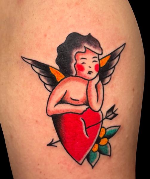 Traditional cherub heart tattoo by @carloszucato