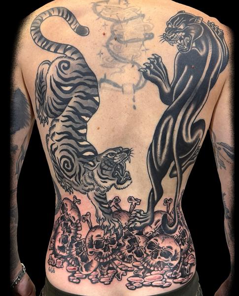 Traditional tiger and panther tattoo by @carloszucato