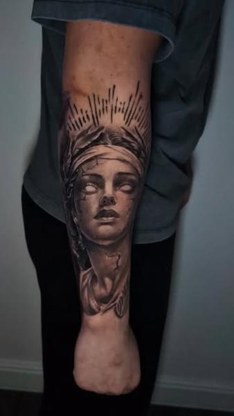 Black and grey realism cracked statue woman tattoo by @inkside1812