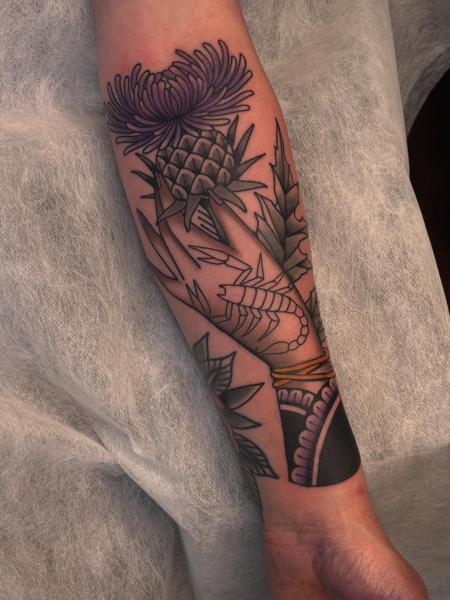 Traditional floral thistle tattoo by @cedric.weber.tattoo