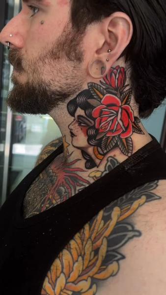 Traditional woman with rose tattoo by @cedric.weber.tattoo