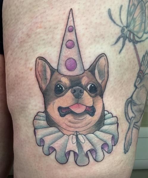 Illustrative clown dog tattoo by @charliesullivantattoo