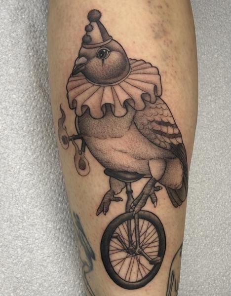 Illustrative clown bird tattoo by @charliesullivantattoo