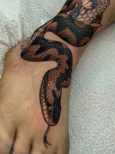 Realism snake tattoo by @charliesullivantattoo