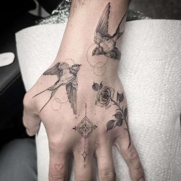 Fine line swallows and rose tattoo by @chazappletattoo