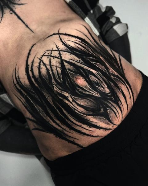 Blackwork abstract brushstrokes tattoo by @charliegatestattoo