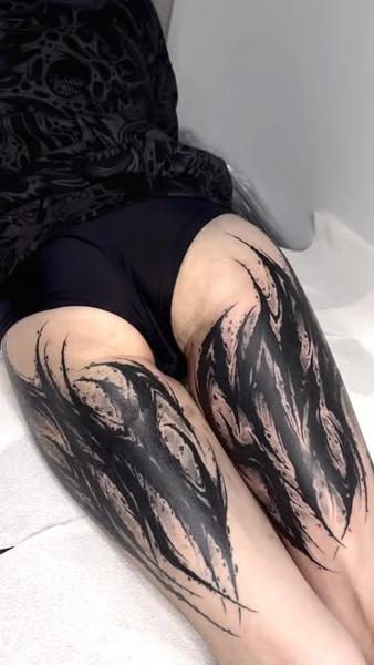 Blackwork abstract flames tattoo by @charliegatestattoo