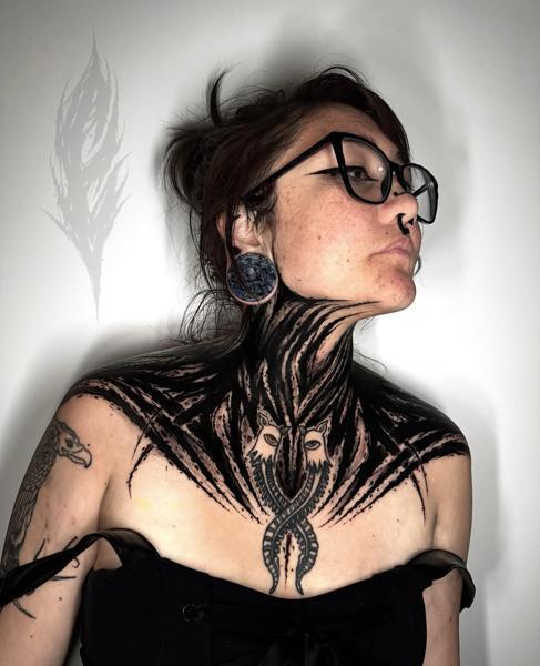 Blackwork abstract animal faces tattoo by @charliegatestattoo