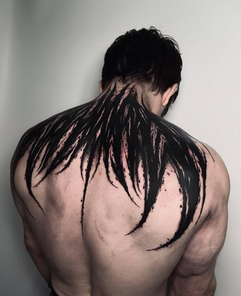 Blackwork abstract wings tattoo by @charliegatestattoo