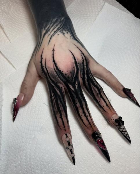 Blackwork demonic hand tattoo by @charliegatestattoo