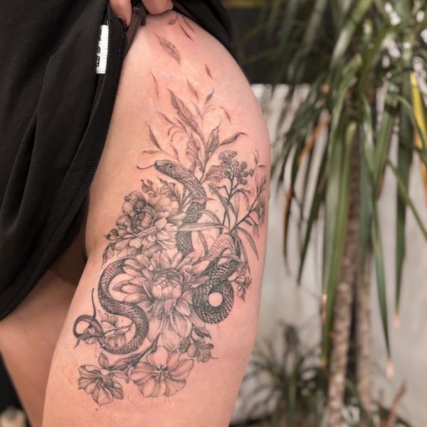 Fine line floral snake tattoo by @charliexneedles