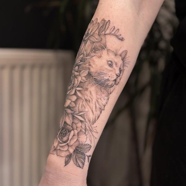 Realism cat with flowers tattoo by @charliexneedles