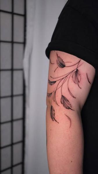 Fine line delicate leaves tattoo by @itschloepeach