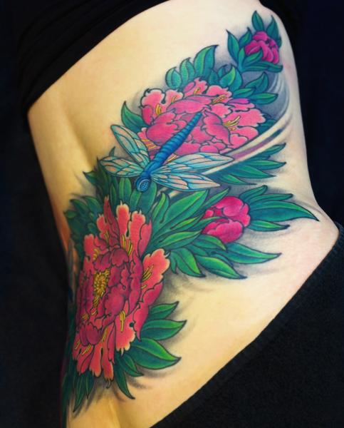 Traditional dragonfly and flowers tattoo by @chriscrookstattoo