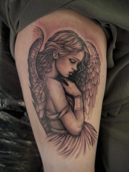 Realism angel portrait tattoo by @chrishatchtattoo