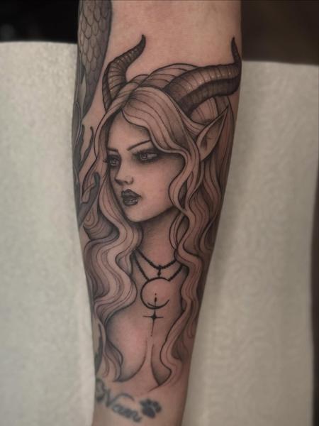 Realism horned woman tattoo by @chrishatchtattoo