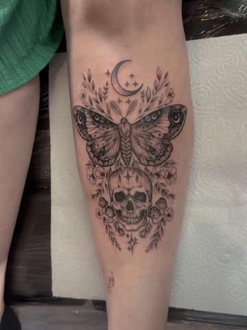 Blackwork moth and skull tattoo by @chrishatchtattoo