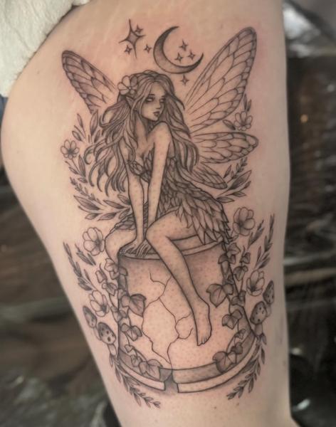 Fine line fairy on column tattoo by @chrishatchtattoo