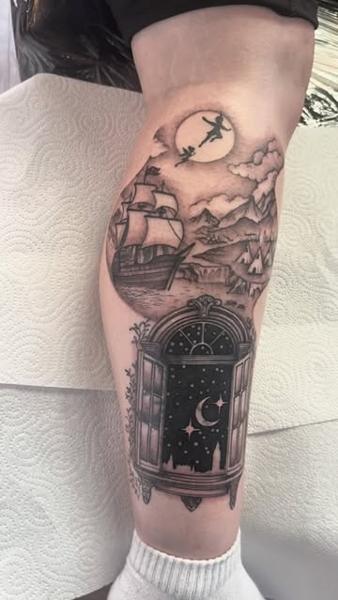 Blackwork peter pan scene tattoo by @chrishatchtattoo