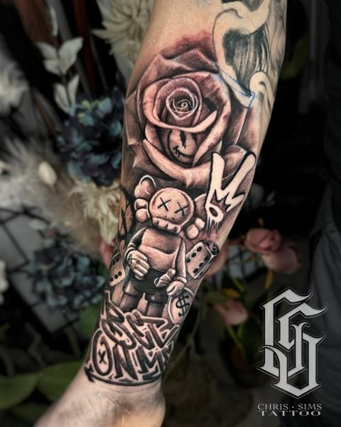 Illustrative kaws rose graffiti tattoo by @chrissimstattoo