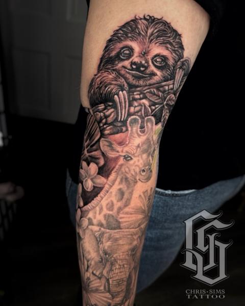 Realism tropical animals tattoo by @chrissimstattoo