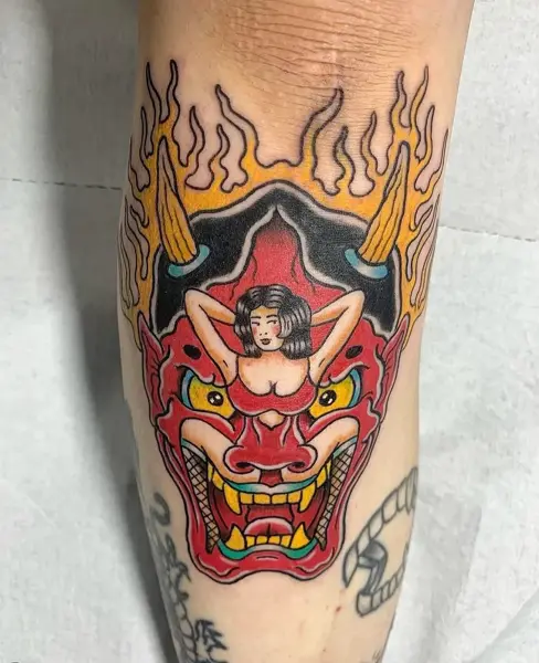 Traditional demon mask tattoo by @radntrad.tattoos