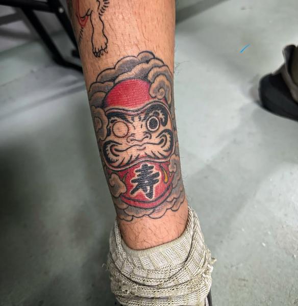 Traditional daruma doll tattoo by @radntrad.tattoos