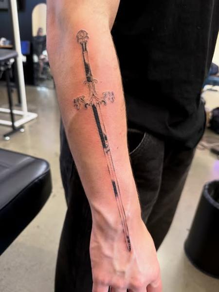 Fine line ornate sword tattoo by @jiffaloaf
