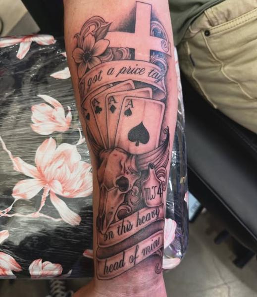 Realism skull with cards tattoo by @jiffaloaf