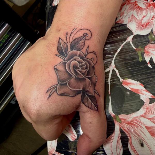 Blackwork rose tattoo by @jiffaloaf