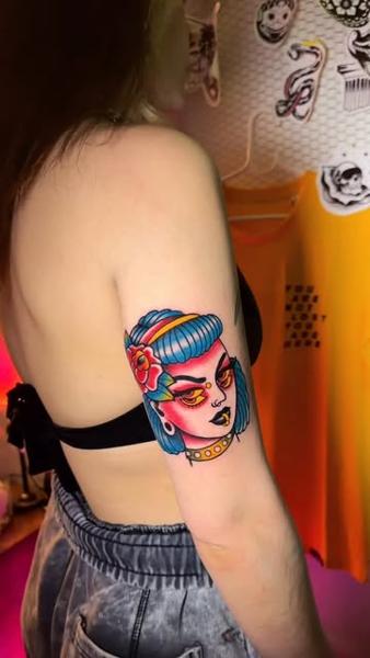 Traditional colorful woman tattoo by @moch.tattoo