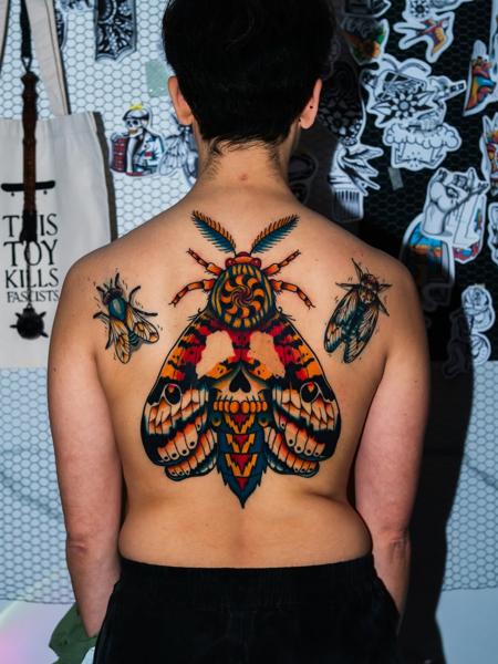 Traditional colorful moth tattoo by @moch.tattoo
