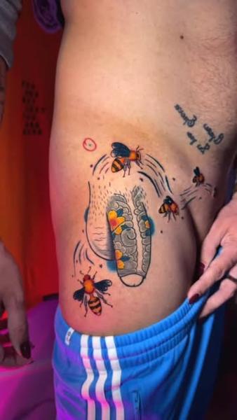 Illustrative bees and honeycomb tattoo by @moch.tattoo