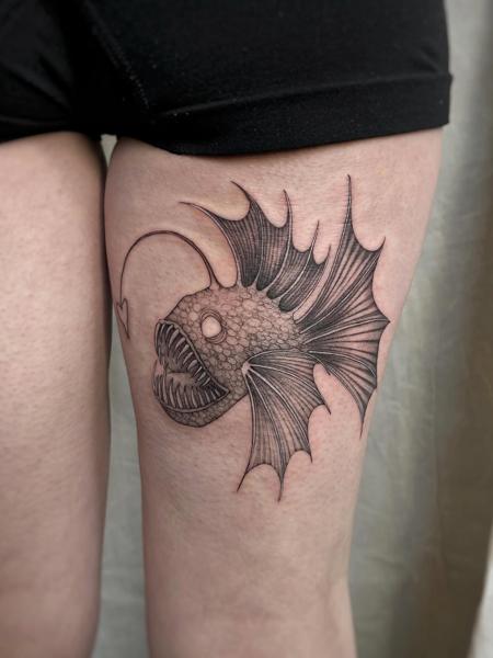 Linework anglerfish tattoo by @clairedaisytattoos