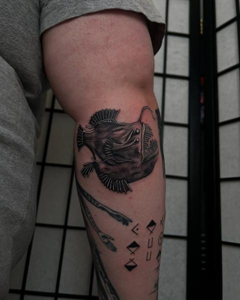 Blackwork anglerfish tattoo by @claretatts