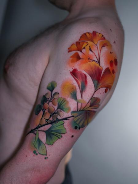 Realism ginkgo leaves tattoo by @cloto.tattoos
