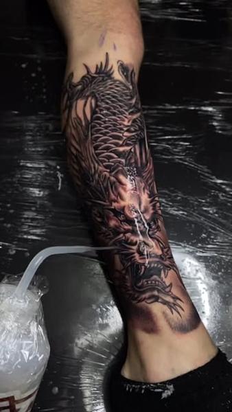 Realism dragon tattoo by @soak_latatt23