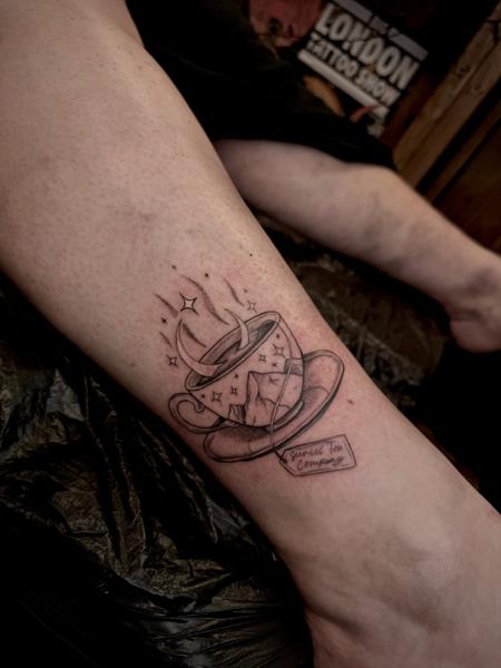 Fine Line cosmic teacup tattoo by @courtneycokertattoos