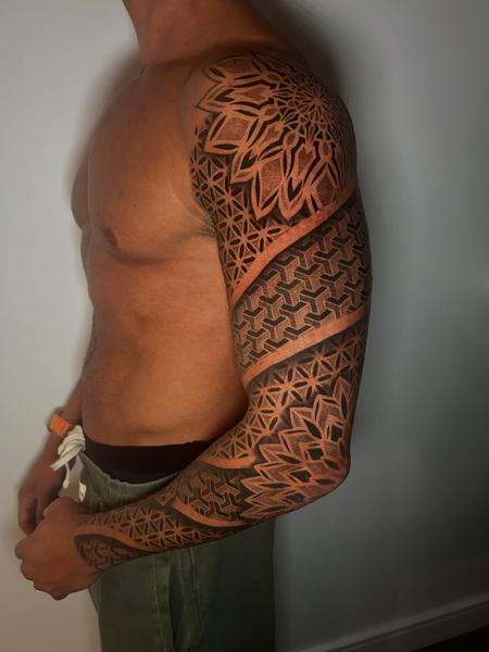 Geometric blackwork geometric sleeve tattoo by @craigedentattoo