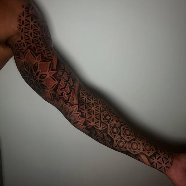 Geometric blackwork geometric patterns tattoo by @craigedentattoo