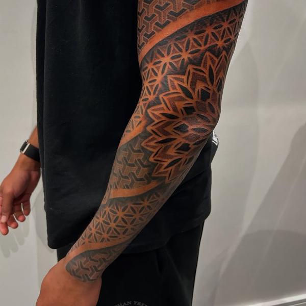 Geometric blackwork geometric patterns tattoo by @craigedentattoo