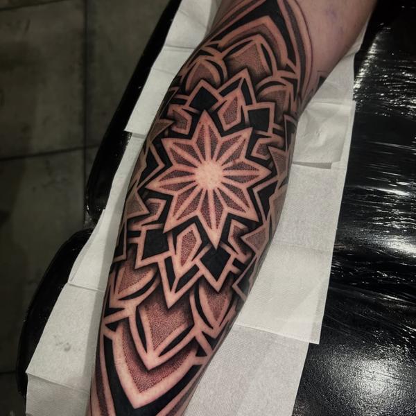 Geometric geometric star tattoo by @craigedentattoo