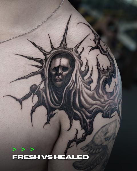 Blackwork hooded figure tattoo by @crawlspace_tattoo