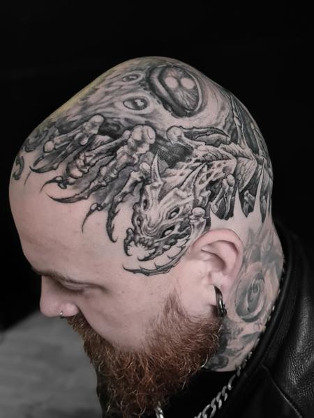 Blackwork dragon skull tattoo by @crawlspace_tattoo