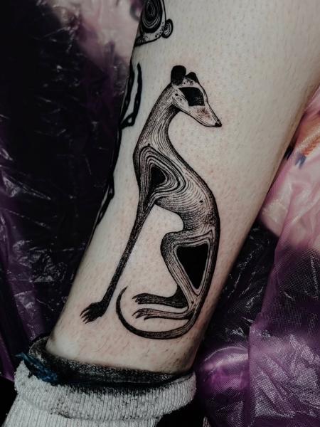 Blackwork stylized greyhound tattoo by @freakyface_