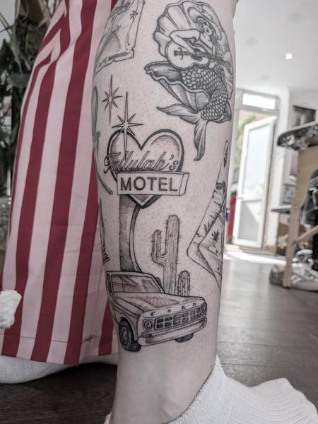 Illustrative motel sign truck tattoo by @daisy_tattooing