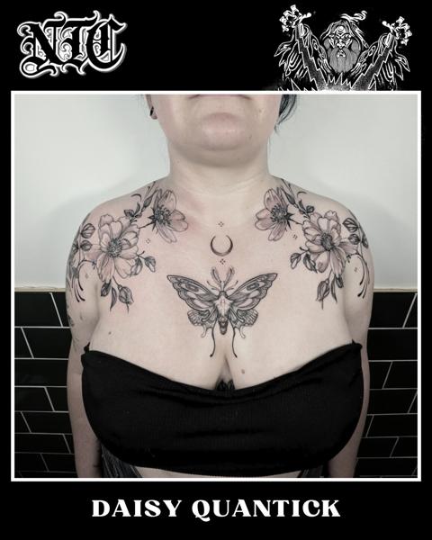 Blackwork floral moth tattoo by @daisy_tattooing