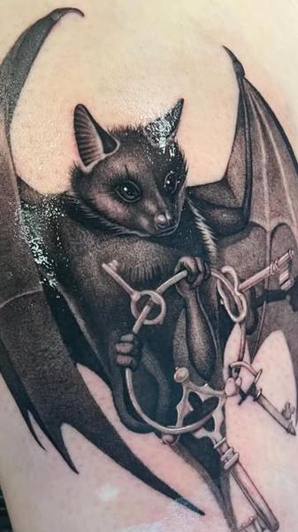 Realism bat with keys tattoo by @danijtattoo