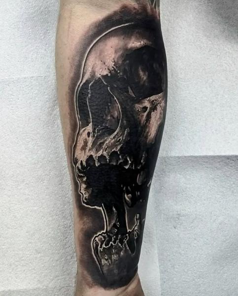 Realism skull silhouette tattoo by @danny_tattooart