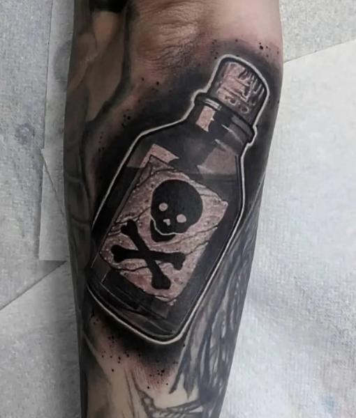 Realism poison bottle tattoo by @danny_tattooart